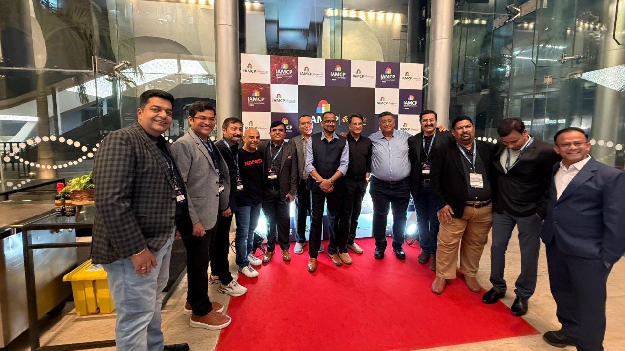 Group photo on the red carpet at the IAMCP event