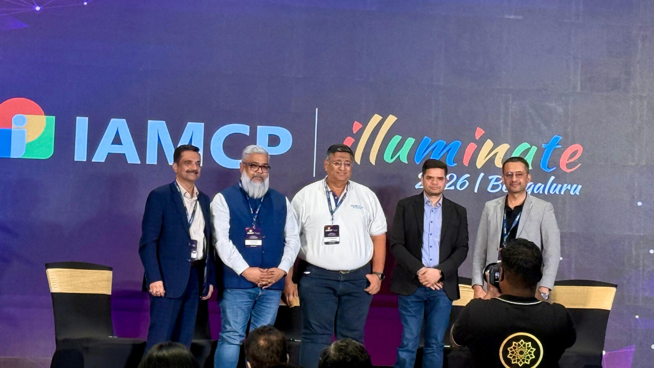 Titan Workspace team at the IAMCP Illuminate 2026 backdrop